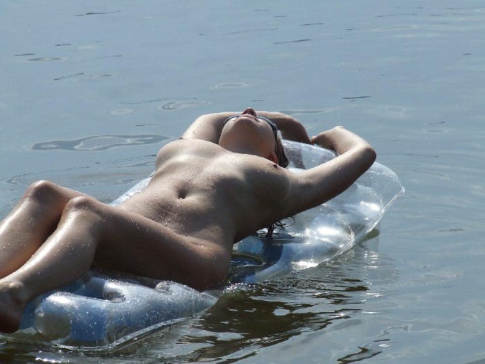 Naked russian girl sunbathes