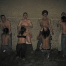 Nude drunken group of young people having fun