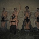 Nude drunken group of young people having fun