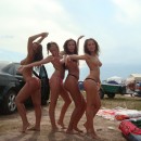 Four girls dancing naked outdoors