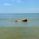 Russian girl with nice body posing at sea