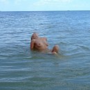 Russian girl with nice body posing at sea