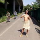 Sweet brunette flashes boobs at public