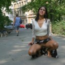 Sexy brunette posing at public