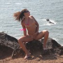 Russian sporty girl posing on the rocks