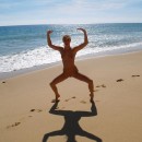 Sexy blonde naked on public beach