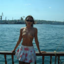 Lovely girl posing naked on boat