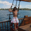 Lovely girl posing naked on boat