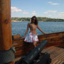 Lovely girl posing naked on boat