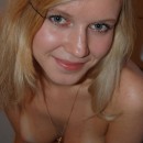 Blonde with big boobs posing at bath