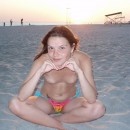 Sporty teen posing topless at the beach