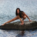 Sporty brunette shows pussy outdoors