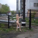 Beautiful sporty blonde posing naked at public