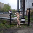 Beautiful sporty blonde posing naked at public