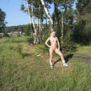 Busty russian blonde walks naked outdoors