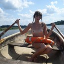 Sexy teen with nice tits posing naked on boat