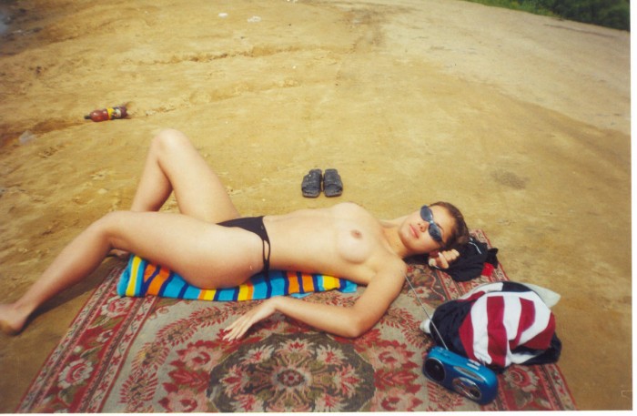 Hot russian chick enjoys a hot summer on the beach.jpg