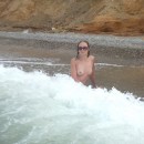 Lovely amateur sporty girl with nice body posing at sea