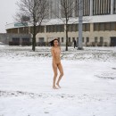 Amazing sporty brunette posing totally naked at winter streets