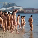 Big group of russian nudists swiming and posing at beach