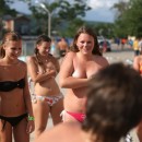 Big group of russian teens participating in the undressing contest