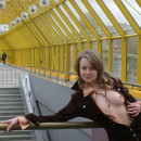 Seductive blonde is not afraid to show her tits in a public place