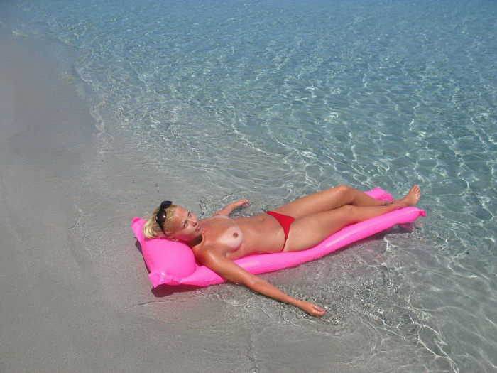 Busty russian blonde on vacation sunbathing