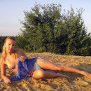 Russian blonde with nice boobs posing outdoors