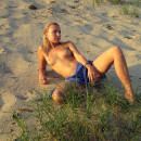 Russian blonde with nice boobs posing outdoors