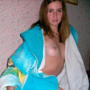 Smiling russian girl with sporty body at home
