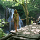 Sexy redhead posing naked at public park