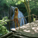 Sexy redhead posing naked at public park