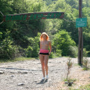 Sporty redhead walks naked at public