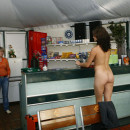 Naked girl wants to drink beer in bar