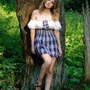 Sexiest babe is undressing at forest