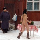 Sporty brunette posing naked at winter