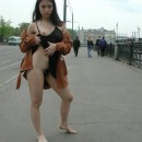 Tiny brunette shows her very hairy big pussy at public