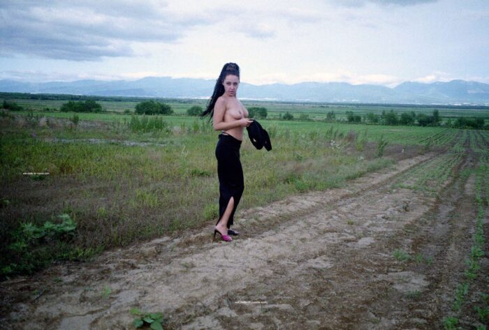 Old photos of curly brunette in the fields