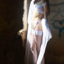 Beautiful babe in beautiful white lingerie at abandoned building