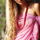 Curly blonde with amazing boobs undresses at forest