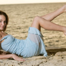 Girl with shaved pussy and soft boobs posing at sunset