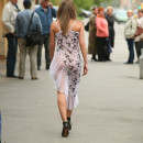 Russian chick flashes her body at a place with many people