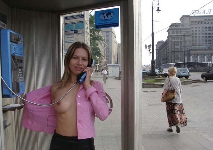 Sporty russian blonde shows her naked body at center of Moscow