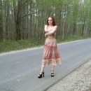 Sporty russian chick is undressing at road