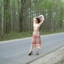 Sporty russian chick is undressing at road