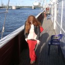 Very sweet redhead teen shows her goods at public boat