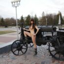 Hot russian teen with big boobs posing near monument