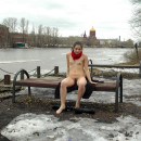 Lovely girl with small tits and hairy pussy posing at pier at winter