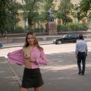 Smiling russian babe walks naked at city center