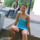 Smiling russian teen flashes her big pussy with piercing at public park